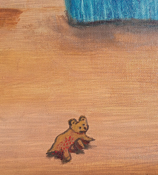 Small teddy bear with a colorful pattern on a textured brown surface
