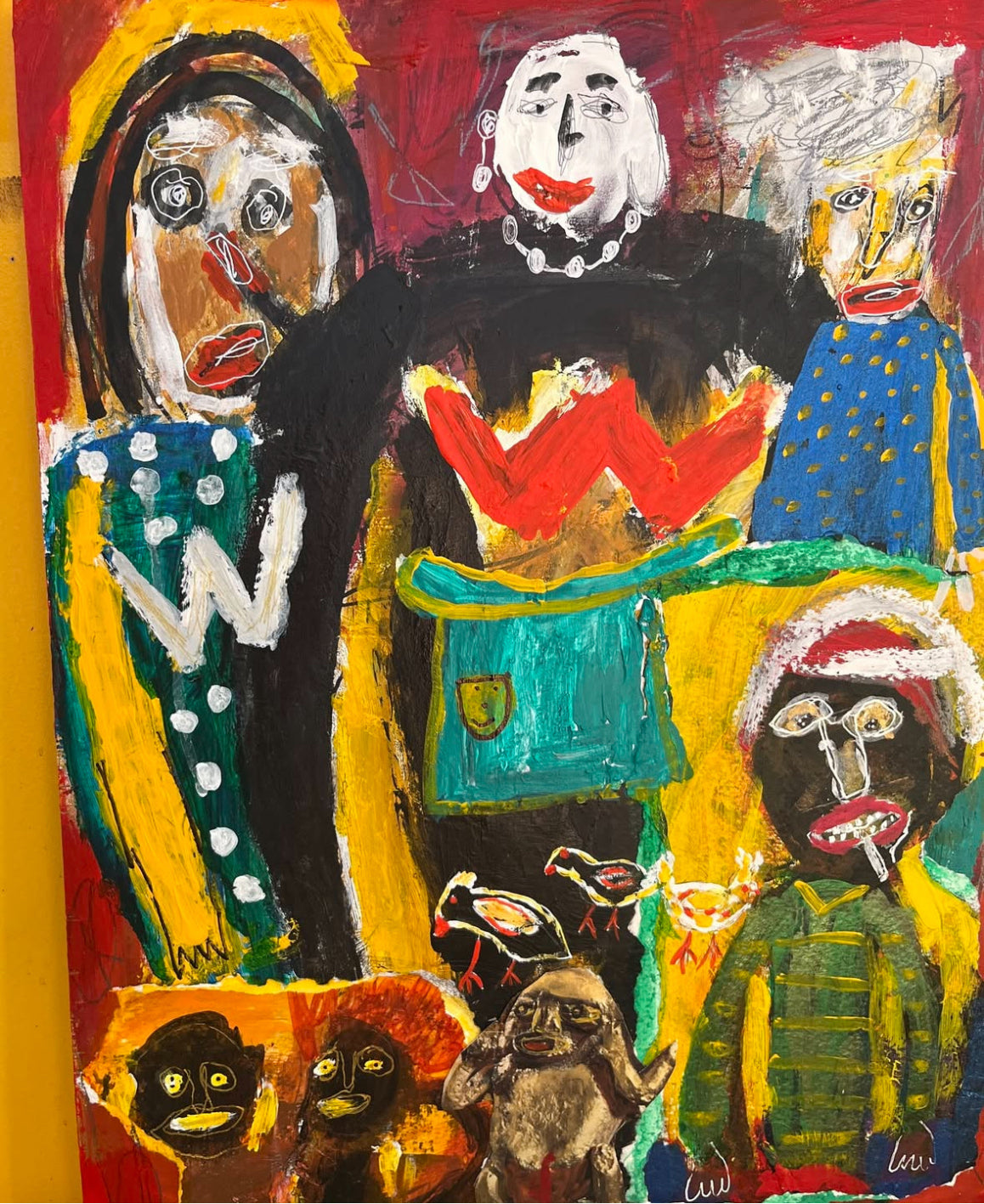 Colorful abstract painting with multiple faces and patterns